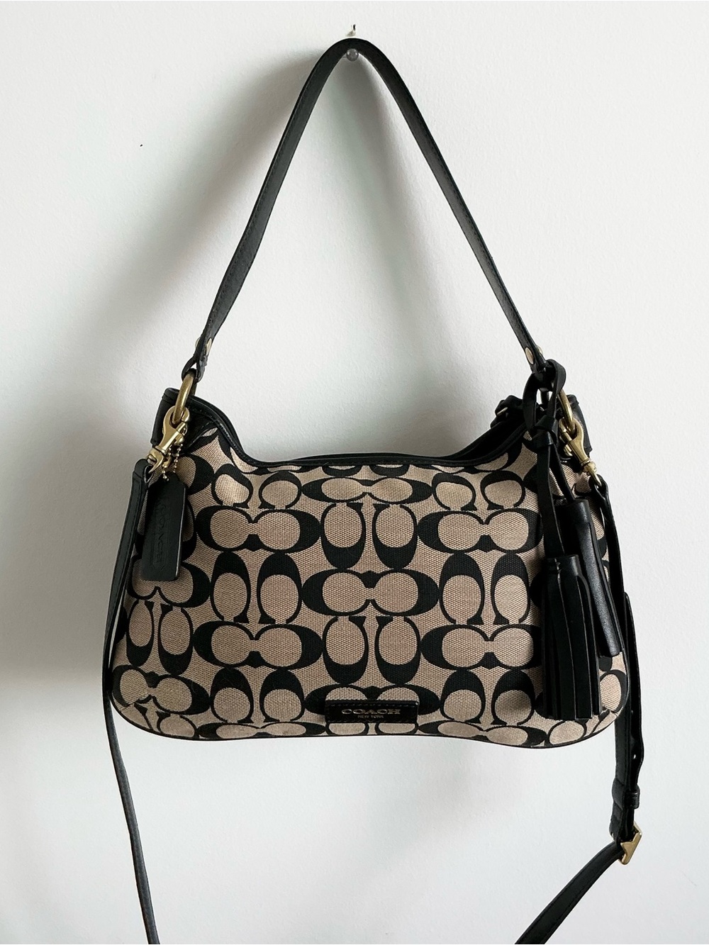 Coach Beige tan Black monogram Canvas Shoulder saddle Bag Tassel purse leather